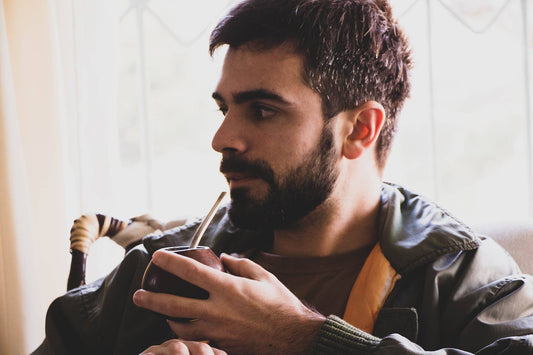 Argentinian drinking a calabash mate gourd