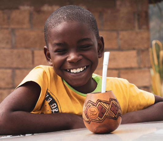 Jamaican boy drinking yerba mate tea