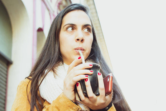 Woman drinking yerba mate in San Telmo, Buenos Aires