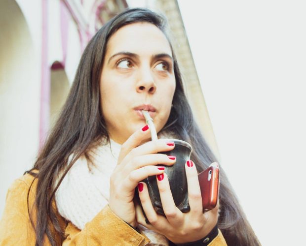 Woman drinking yerba mate in San Telmo, Buenos Aires